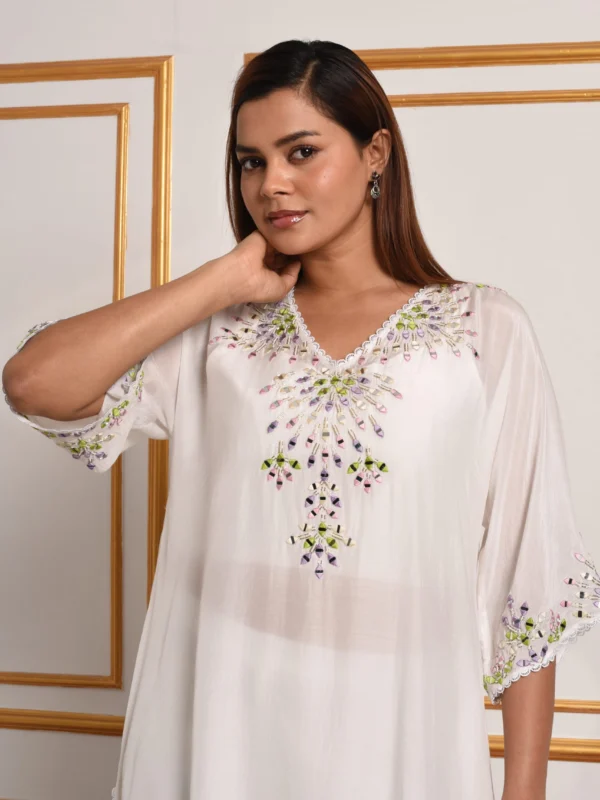 Detail of pastel mosaic hand embroidery and V-neck on Iris White Kurta Suit Set by Embrowhite