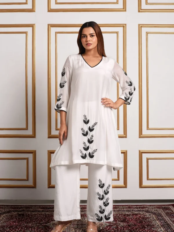 Detailing black lace neckline trim and intricate floral leaf embroidery on Onyx Petal co-ord set by Embrowhite