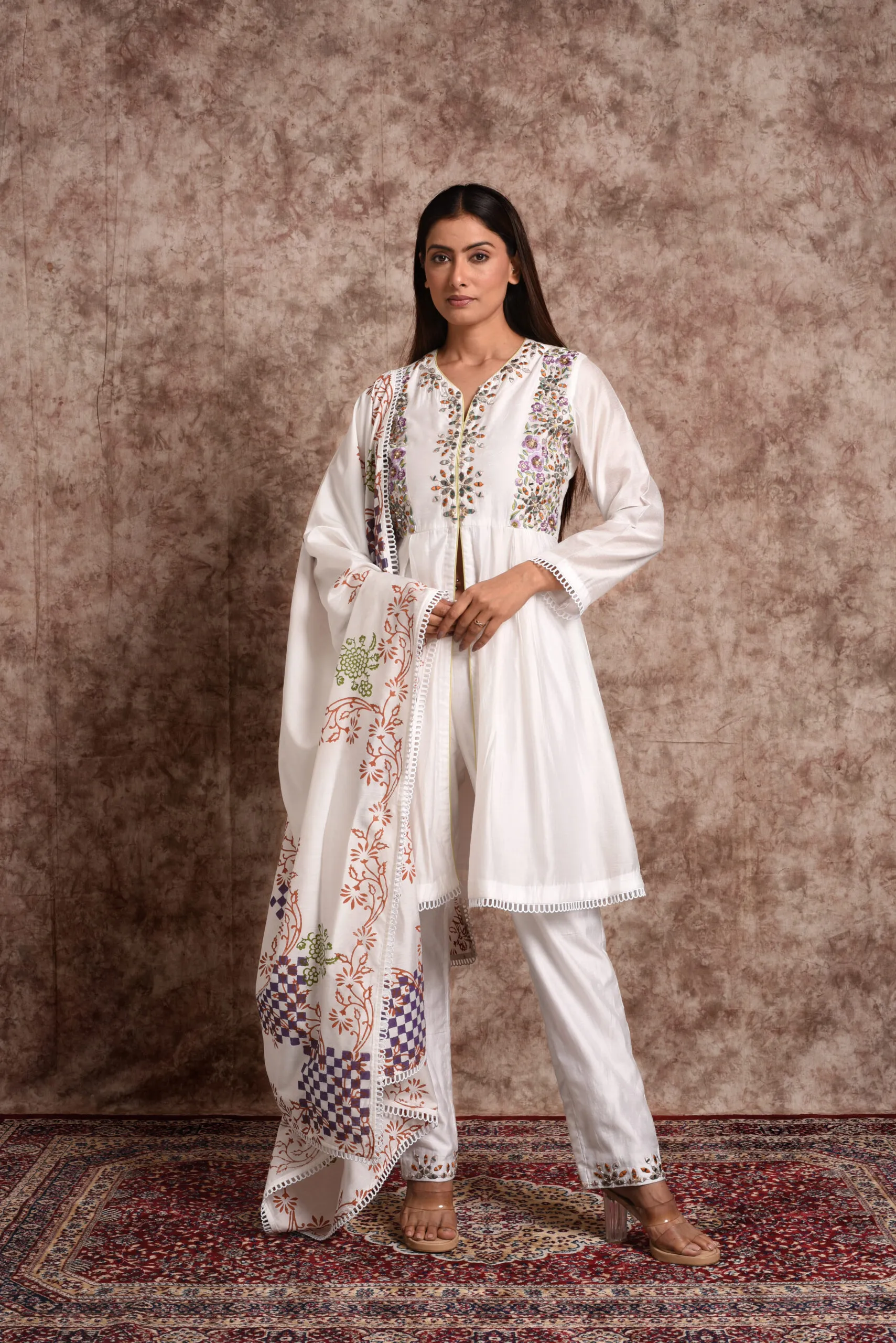 Front full-length view of Gulistan ivory tunic set with floral embroidery and printed lace-trimmed dupatta by Embrowhite Front full-length view of Gulistan ivory tunic set with floral embroidery and printed lace-trimmed dupatta by Embrowhite