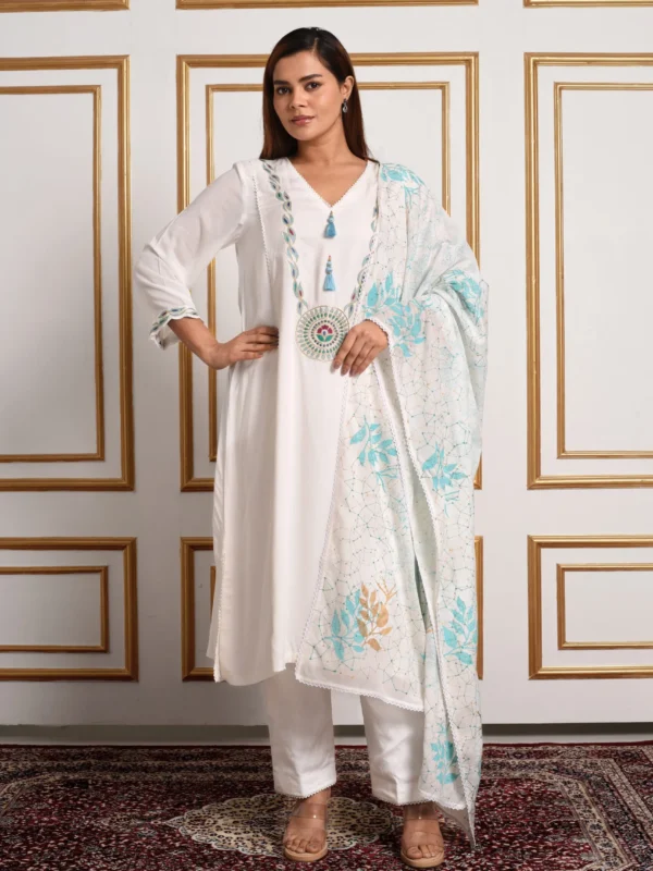 Full-length catalog pose of Kyra ivory embroidered kurta set showing blue circular medallion chest embroidery and printed floral dupatta by Embrowhite
