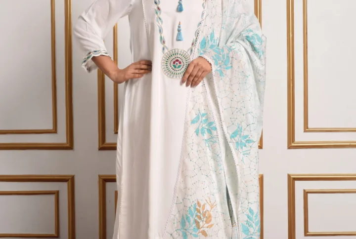 Full-length catalog pose of Kyra ivory embroidered kurta set showing blue circular medallion chest embroidery and printed floral dupatta by Embrowhite