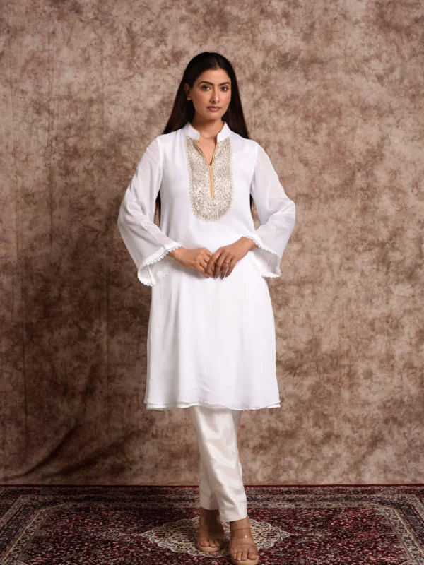 Full-length catalog view of Starlight ivory flared tunic set displaying bell sleeves and tailored straight trousers by Embrowhite