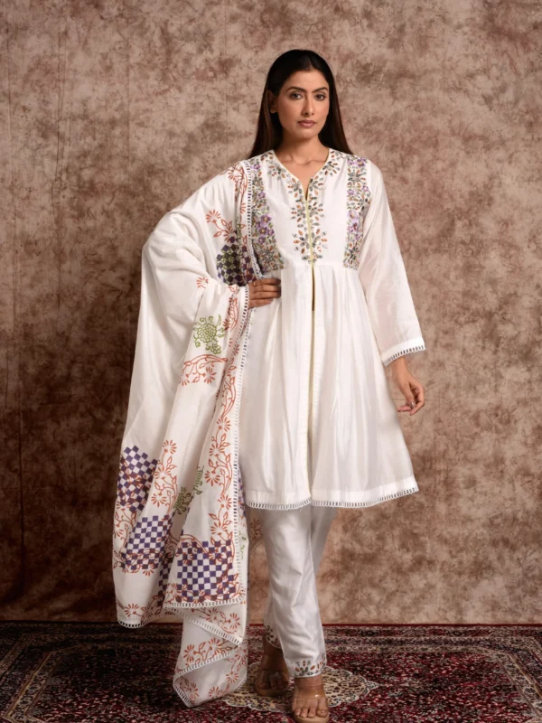 Full-length front catalog shot of Gulistan ivory floral embroidered kurta set styled with printed dupatta by Embrowhite