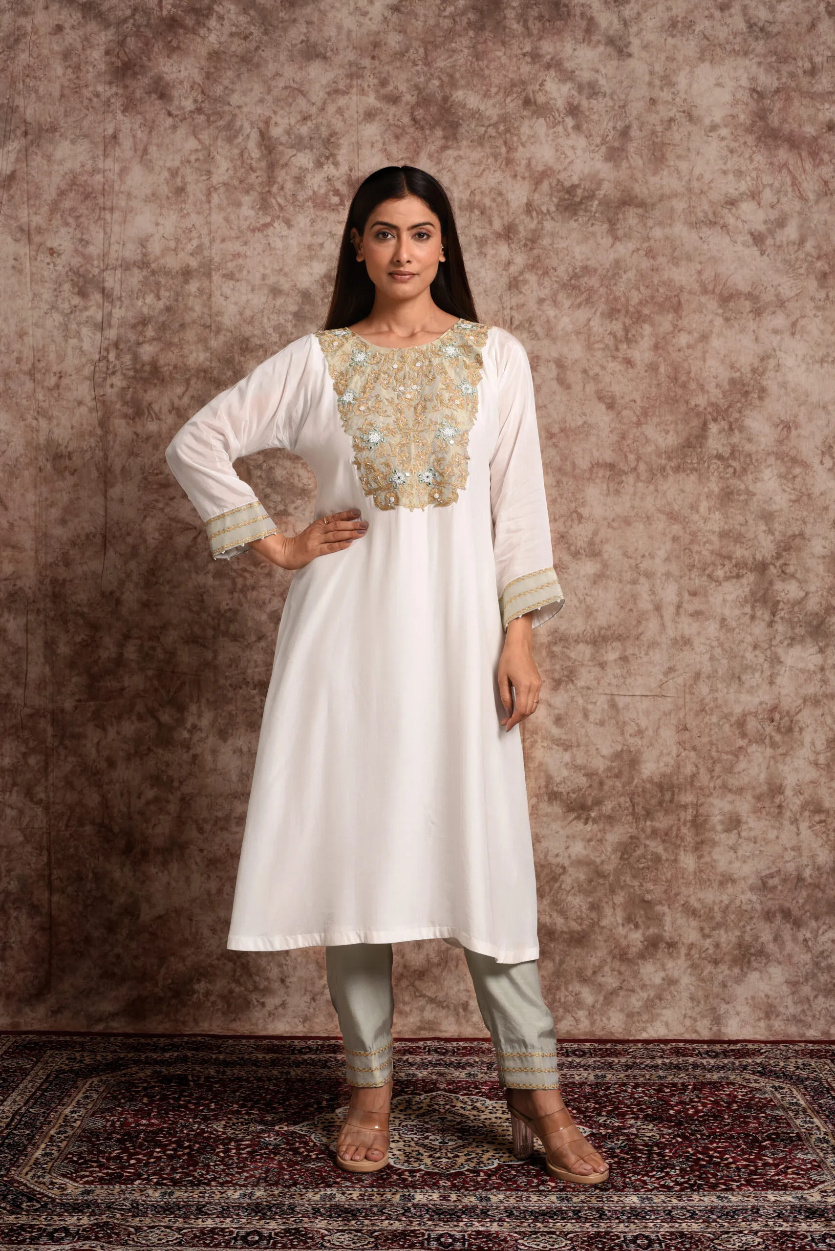 Full-length front catalog view of Verbena mint straight kurta set highlighting gold embroidered bib neck and straight trousers by Embrowhite Full-length front catalog view of Verbena mint straight kurta set highlighting gold embroidered bib neck and straight trousers by Embrowhite