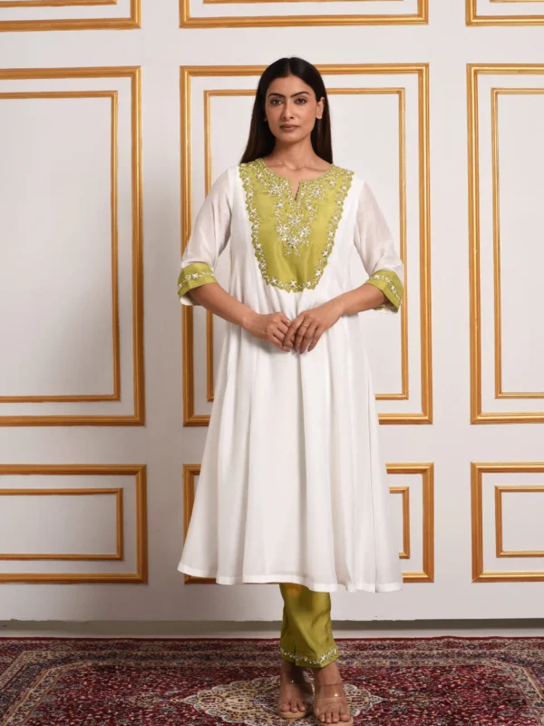 Full-length front view of Gulistan ivory A-line suit set without dupatta showcasing olive embroidered bib and hemmed pants by Embrowhite