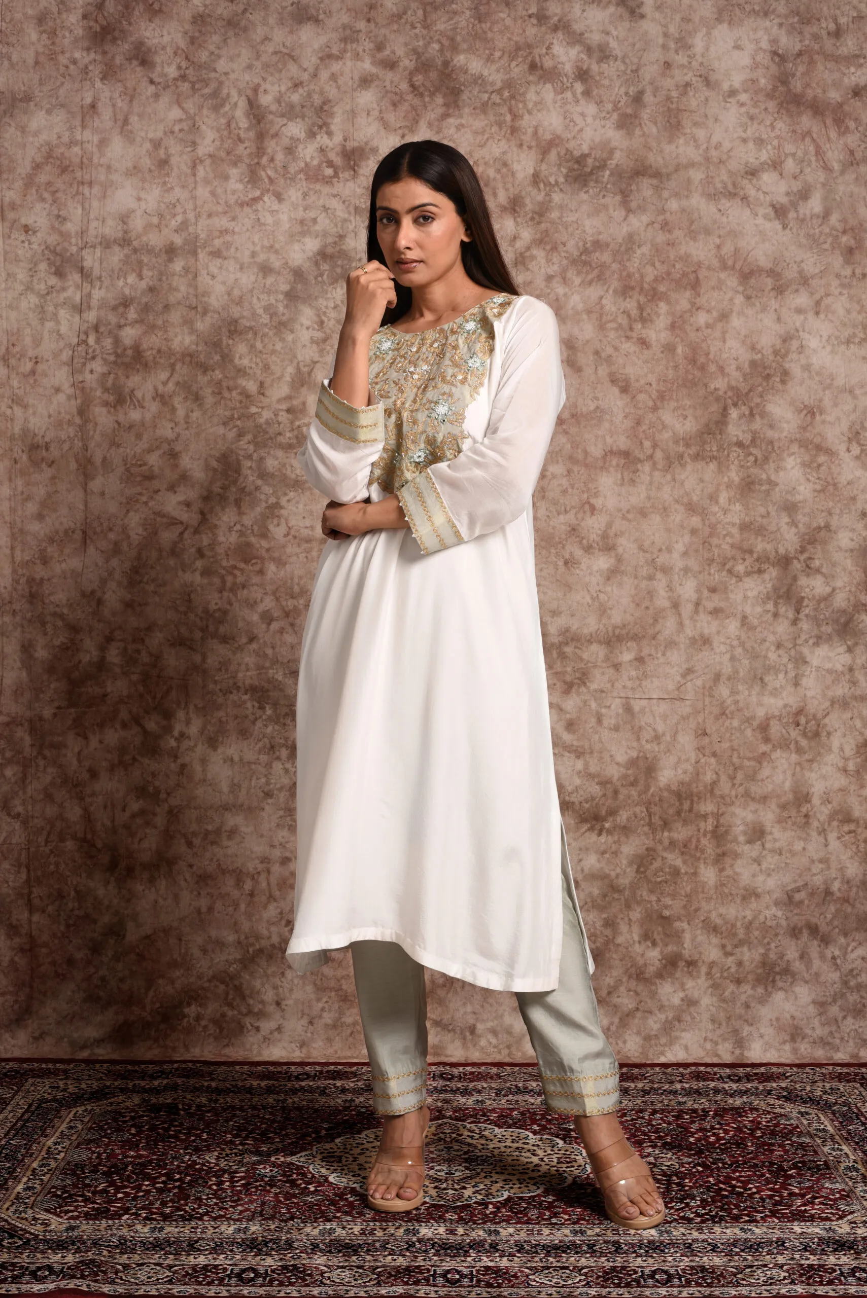 Full-length view of Verbena mint ethnic suit set displaying embroidered neckline and matching pants by Embrowhite Full-length view of Verbena mint ethnic suit set displaying embroidered neckline and matching pants by Embrowhite