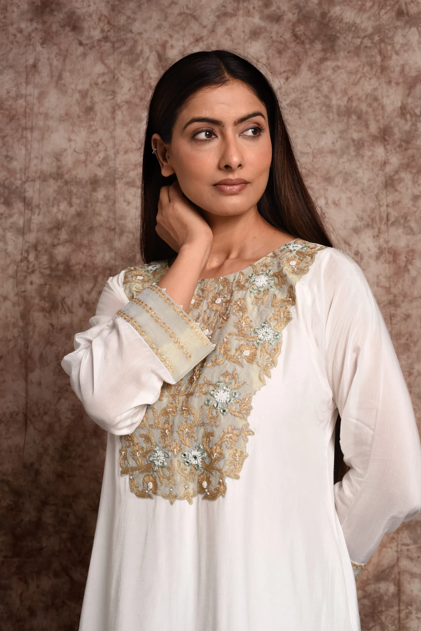 Medium close-up shot of Verbena mint kurta highlighting intricate zardozi and sequin embroidery on round neckline by Embrowhite Medium close-up shot of Verbena mint kurta highlighting intricate zardozi and sequin embroidery on round neckline by Embrowhite