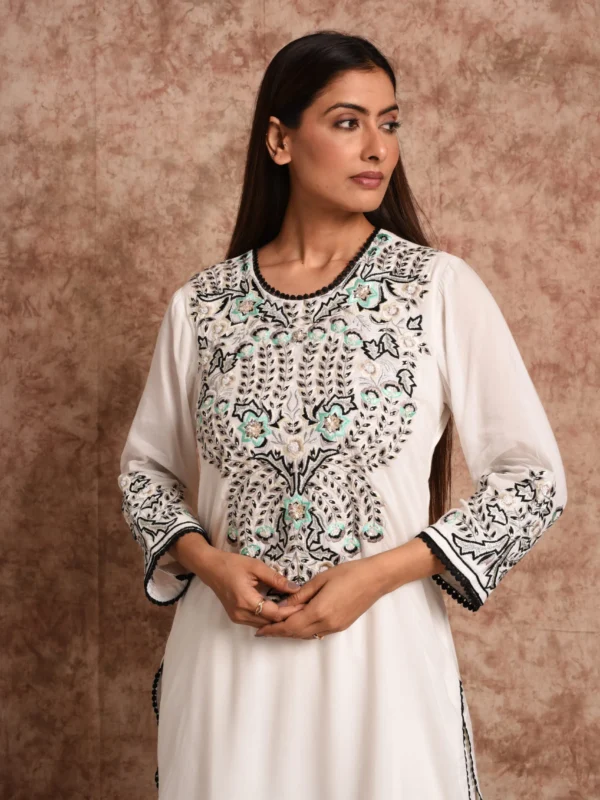 Medium front shot detailing the intricate floral yoke embroidery and cuff threadwork on Aurelia ivory suit set by Embrowhite