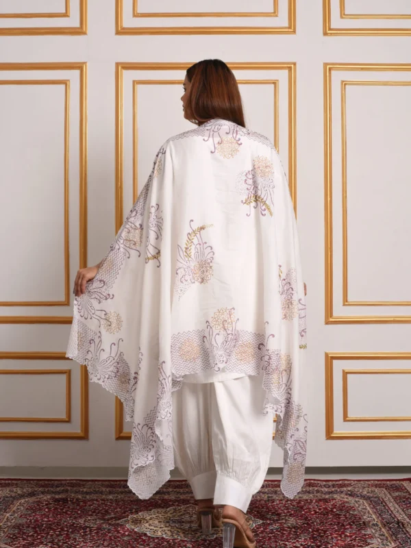 Back view displaying draped white and purple vine printed dupatta paired with Meher dhoti pants set by Embrowhite
