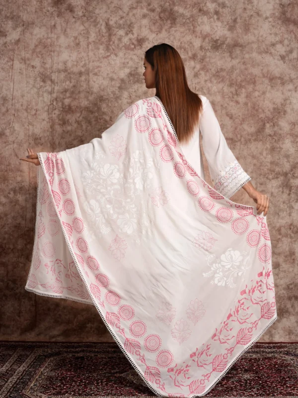 Back view of model spreading out pink printed dupatta with EmbroWhite Flora ivory kurta set