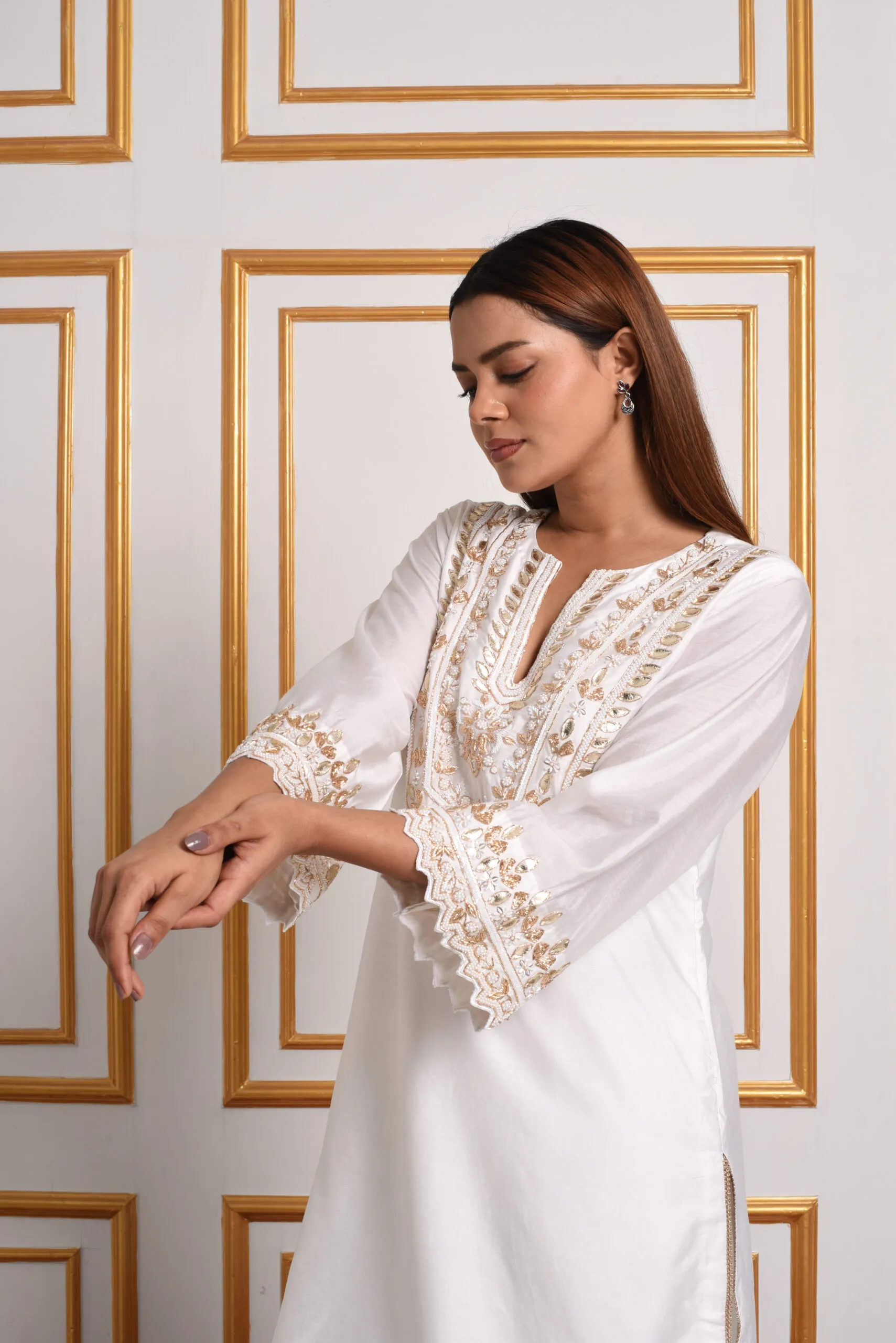 EmbroWhite ivory silk kurta with gold embroidered yoke close up front view EmbroWhite ivory silk kurta with gold embroidered yoke close up front view
