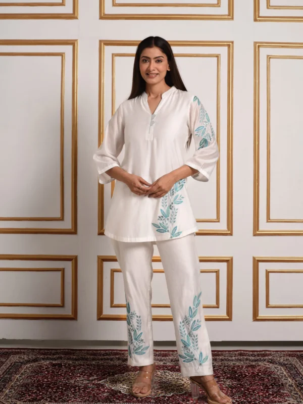 Ethereal white silk tunic with blue leaf motif embroidery and matching trousers by Embrowhite