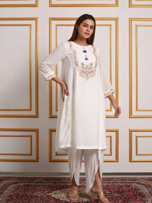 Full-length front view of Vanya white embroidered kurta with draped ethnic dhoti pants by Embrowhite