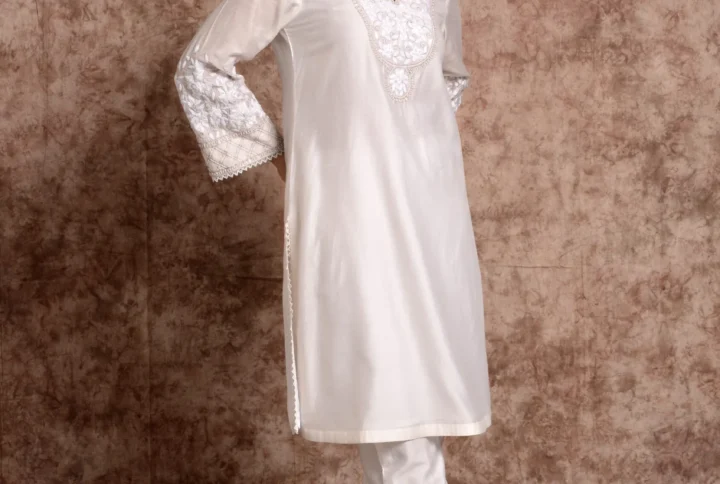 Full-length view of Kaira white embroidered short tunic with matching straight trousers by Embrowhite