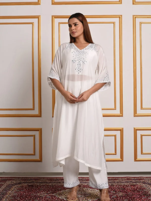 Full-length view of Sage Radiance white sheer kaftan kurta set displaying mirror-work neckline and embroidered trouser hems by Embrowhite