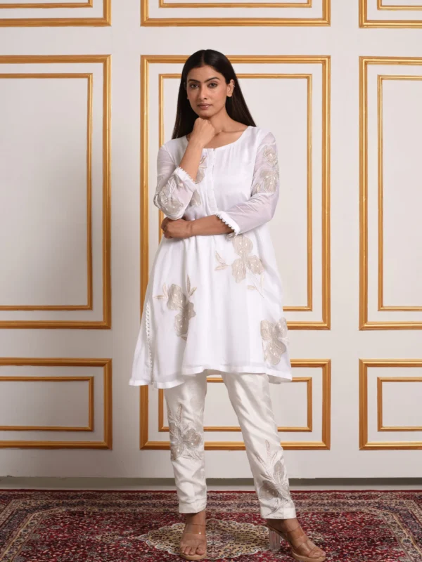 Full-length view of model posing in Pastel Mosaic white short tunic co-ord set with matching embroidered pants